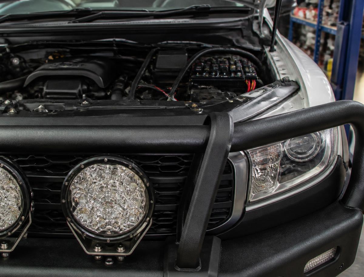 4WD with driving lights and accessory wiring installed under the bonnet